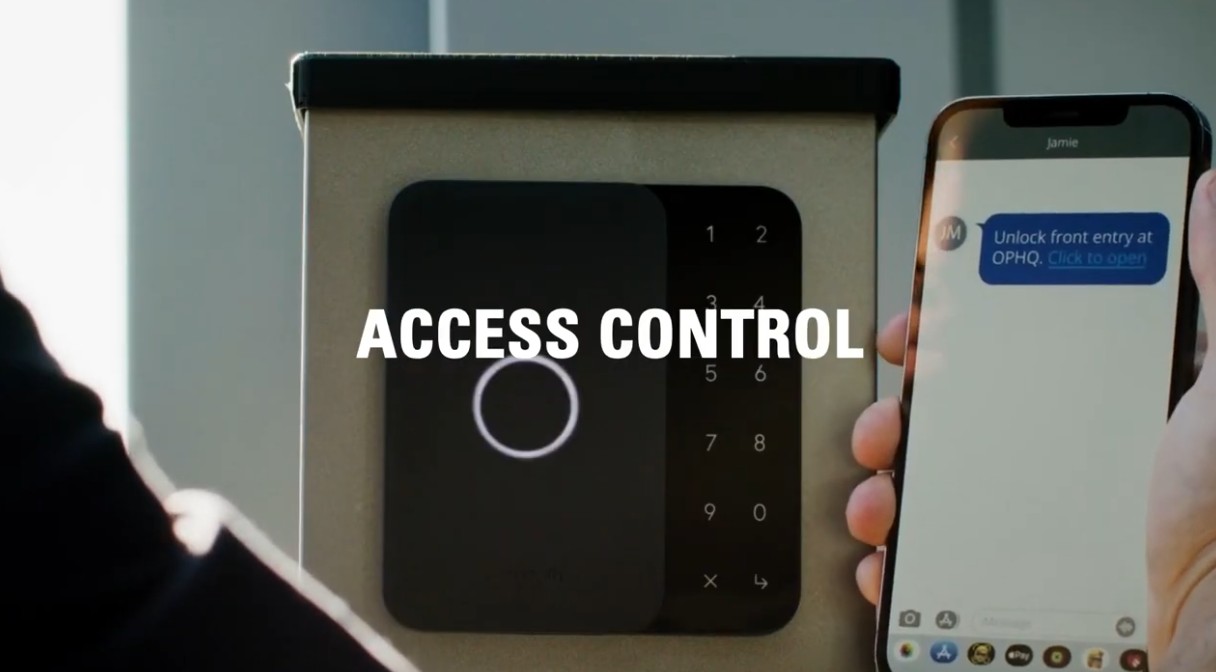 A person holds a smartphone displaying a text message next to an electronic access control keypad with a circular sensor. The words "Access Control" are overlaid in the center.